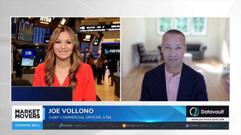 A FINTECH.TV Market Movers segment shows a host at the NYSE beside Joe Vollono speaking from a remote home office on a split-screen broadcast.