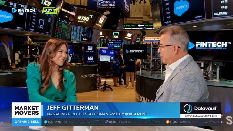 Jeff Gitterman speaks with a host on the NYSE floor beside Market Movers graphics and live market screens.