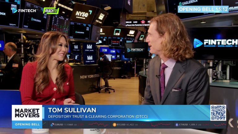 Tom Sullivan of DTCC speaks with a Fintech TV host on the New York Stock Exchange floor during Opening Bell.