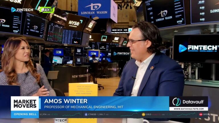 Amos Winter speaks on FINTECH.TV's Market Movers at the New York Stock Exchange, with trading screens and branding behind him.